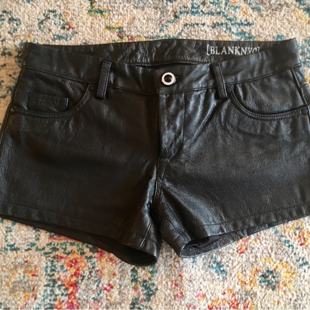 Leather shorts. Cool with nylon/tights, boots in fall and edgy staple in summer.